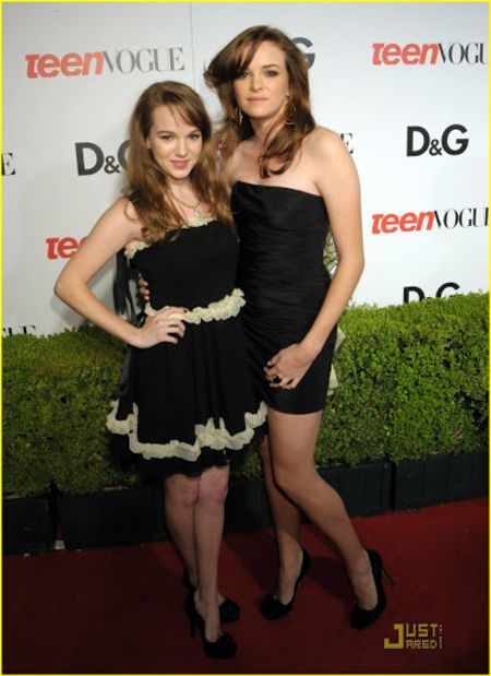 The Panabaker sisters striking a pose at red carpet.
